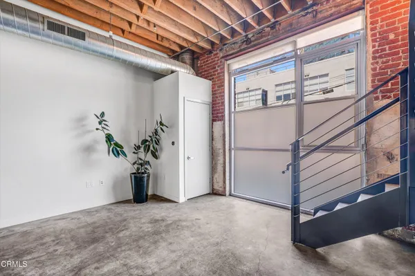 a bathroom with a bathtub shower sink mirror and toilet