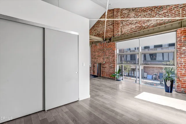 a view of a glass door with wooden floor