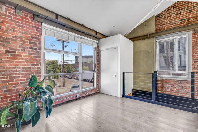 a view of balcony with small garden