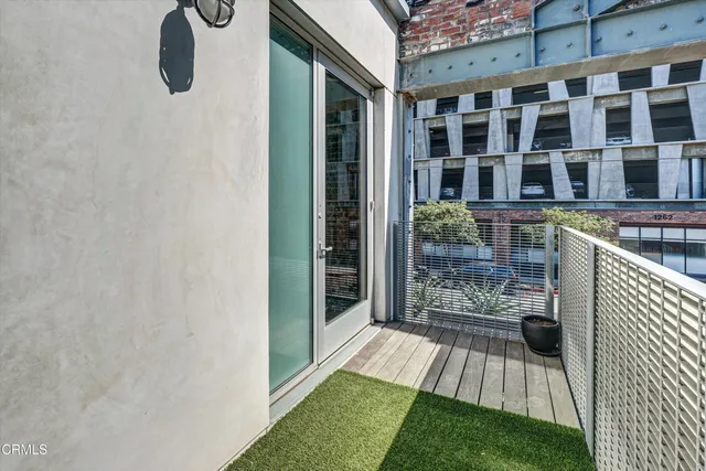 a bathroom with a glass shower door and a window