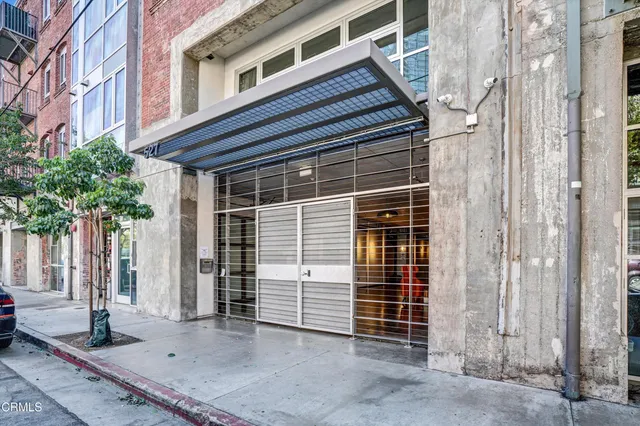 a view of a swimming pool with lawn chairs and a yard