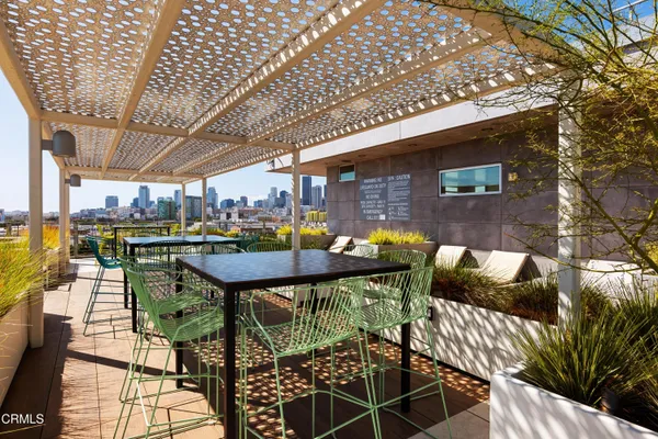 a backyard of a house with outdoor seating