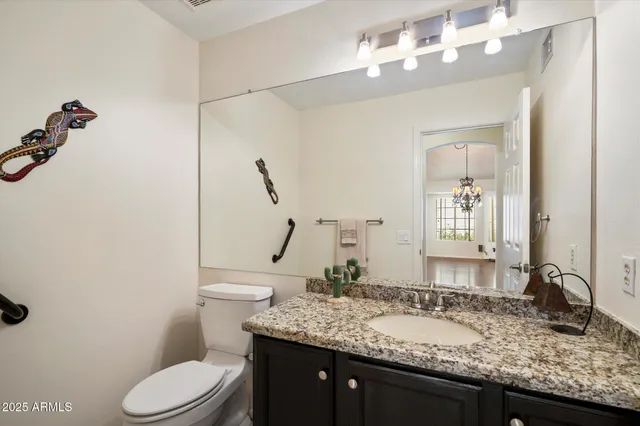 a bathroom with a granite countertop bathtub sink and mirror