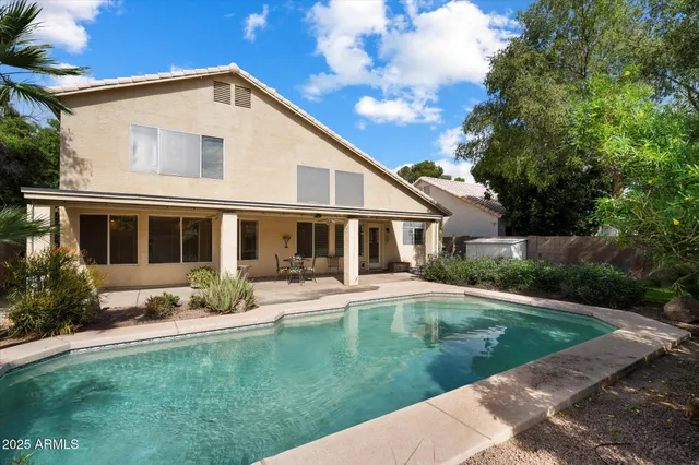 a view of a house with swimming pool