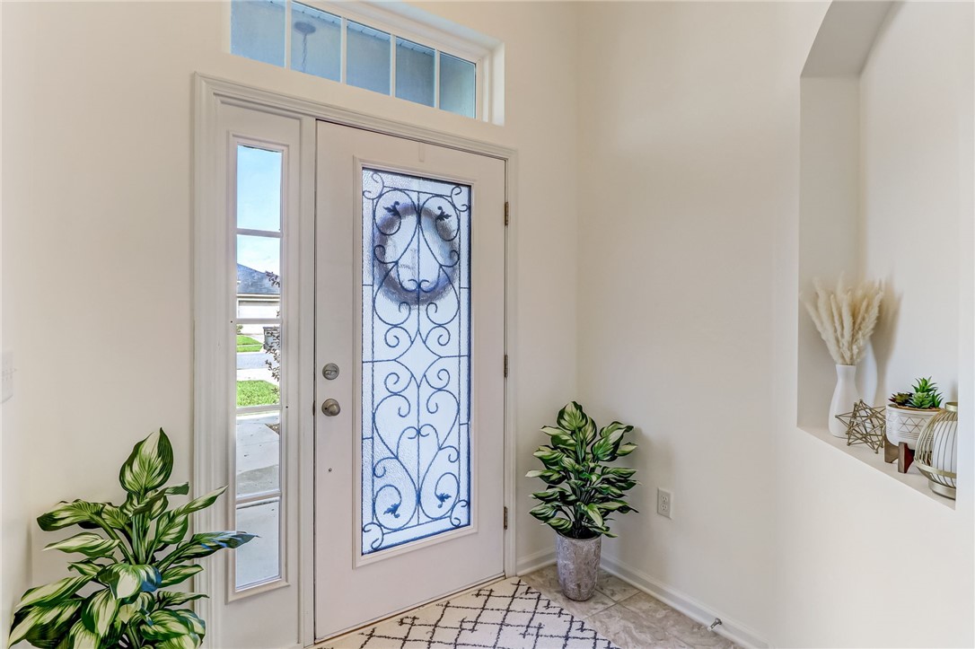 97642 Albatross Drive Yulee, FL 32097 - Photo 10 of 27 a vase with flowers sitting on a floor