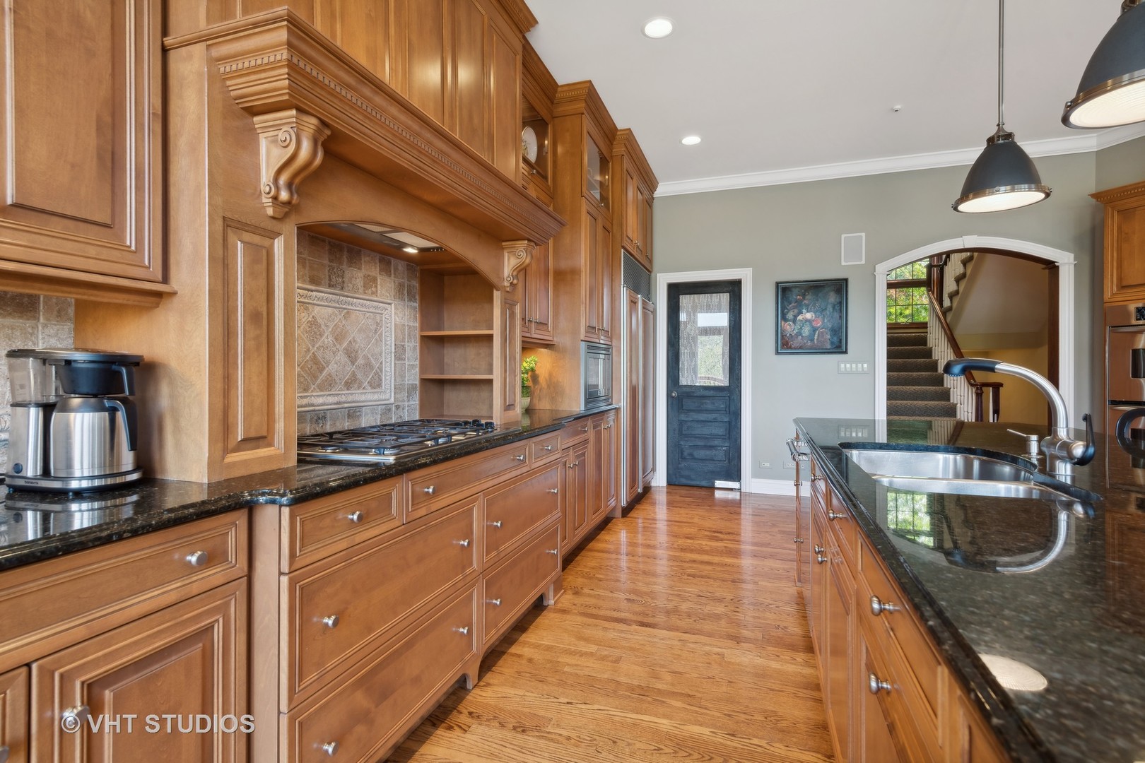 5 Porter School Road Barrington, IL 60010 - Photo 21 of 79 a kitchen with granite countertop a sink and a stove top oven