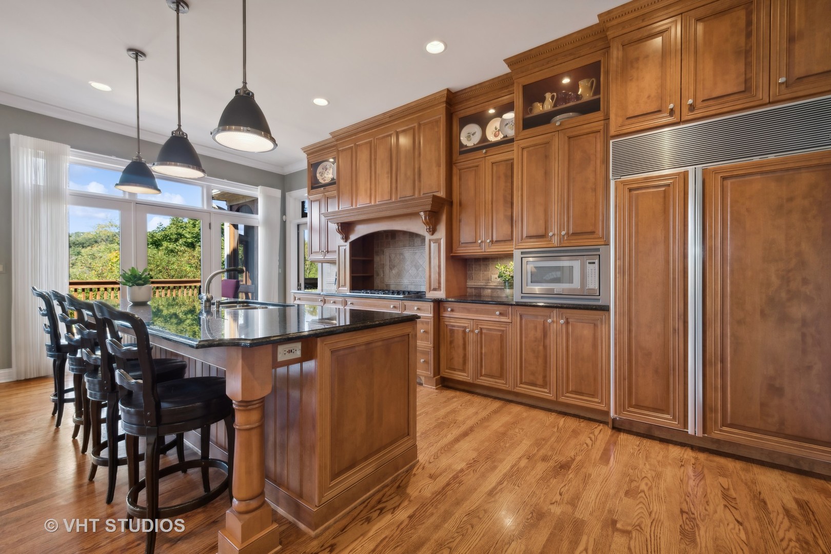 5 Porter School Road Barrington, IL 60010 - Photo 24 of 79 a kitchen with stainless steel appliances granite countertop a sink a stove and a wooden floors