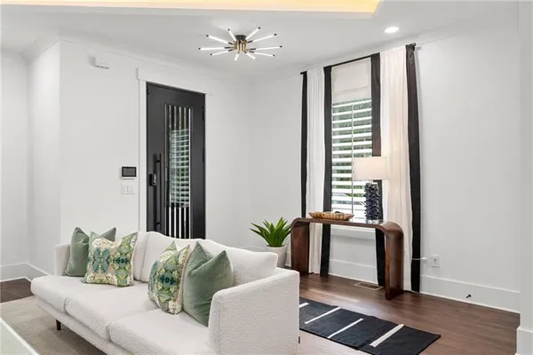 a dining room with furniture and wooden floor