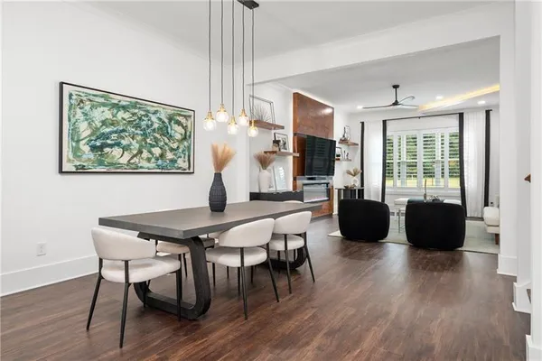 a kitchen with a sink cabinets and wooden floor