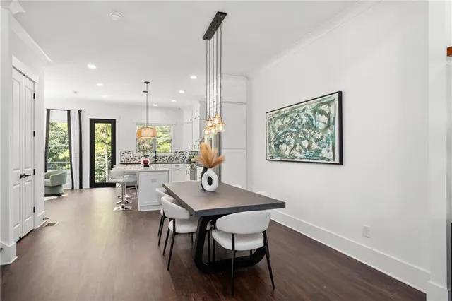 a kitchen with stainless steel appliances a sink a stove and a window