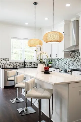 a living room with furniture potted plant and a window