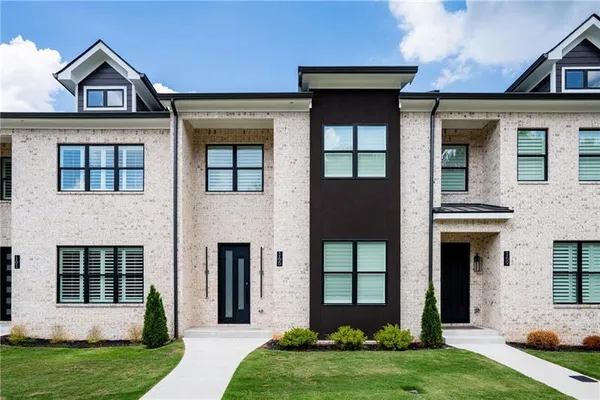 front view of a house with a yard