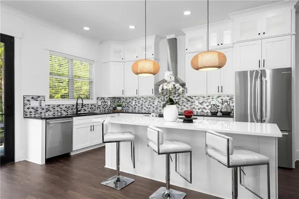 a view of a hallway with a window and stairs