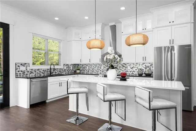 a view of a hallway with a window and stairs