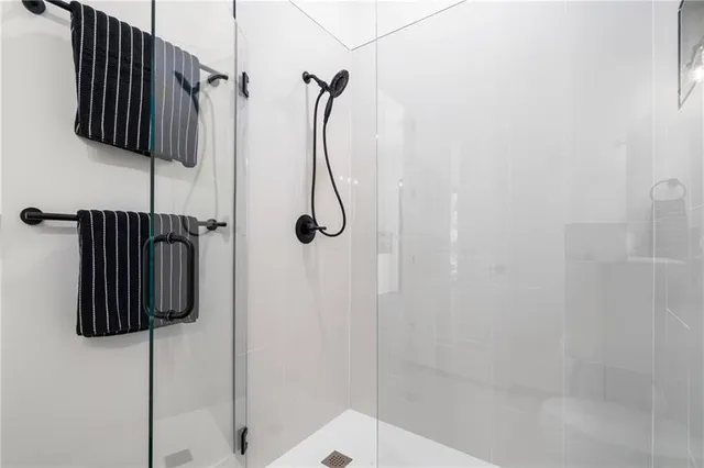 a bathroom with a double vanity sink and mirror
