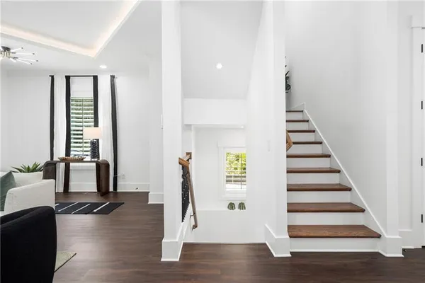 a view of living room with furniture and a floor to ceiling window