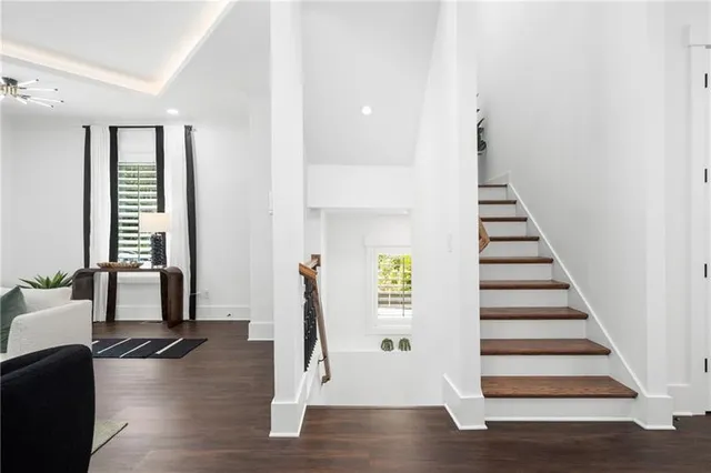a view of living room with furniture and a floor to ceiling window