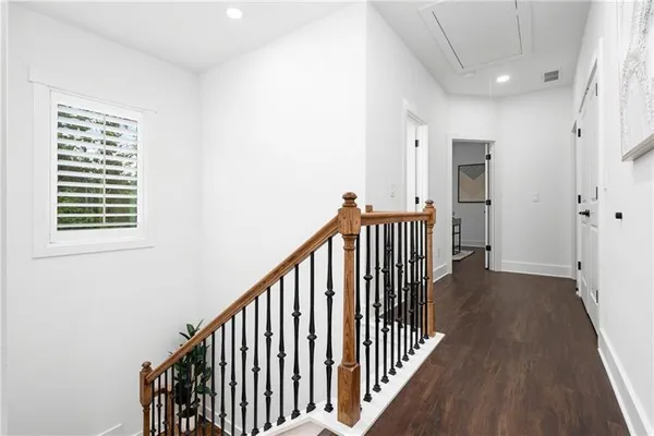 a white bath tub sitting next to a white toilet
