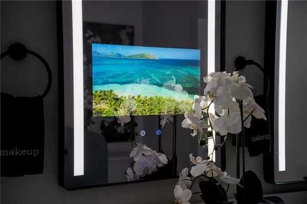 a view of a workspace with furniture and wooden floor