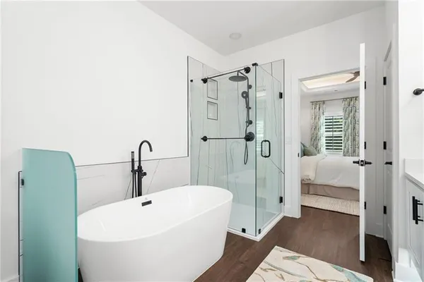 a bathroom with a sink a toilet and a shower curtain