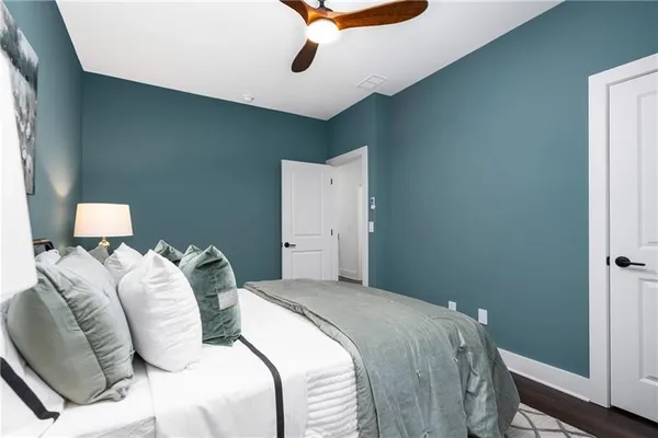 a view of a house with a yard and lake view