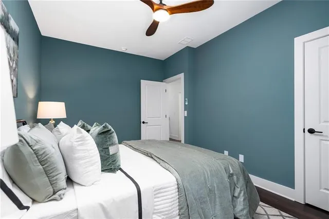 a view of a house with a yard and lake view