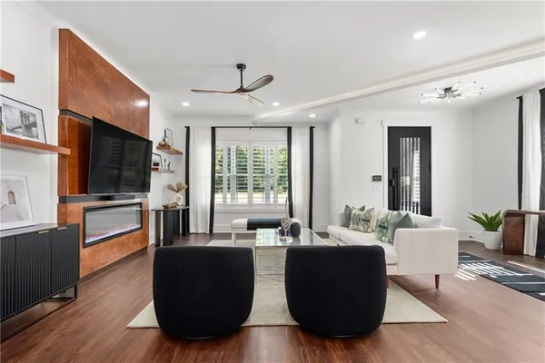 a hallway with windows and wooden floor