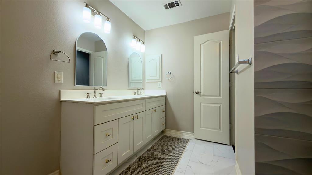 4303 Willow Ridge Drive Parker, TX 75002 - Photo 17 of 20 Bathroom featuring double vanity and light marble finish flooring
