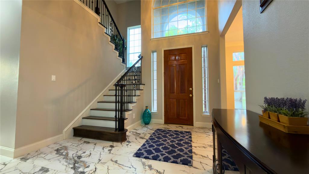 4303 Willow Ridge Drive Parker, TX 75002 - Photo 3 of 20 Entryway with a high ceiling and light marble tile finish floors