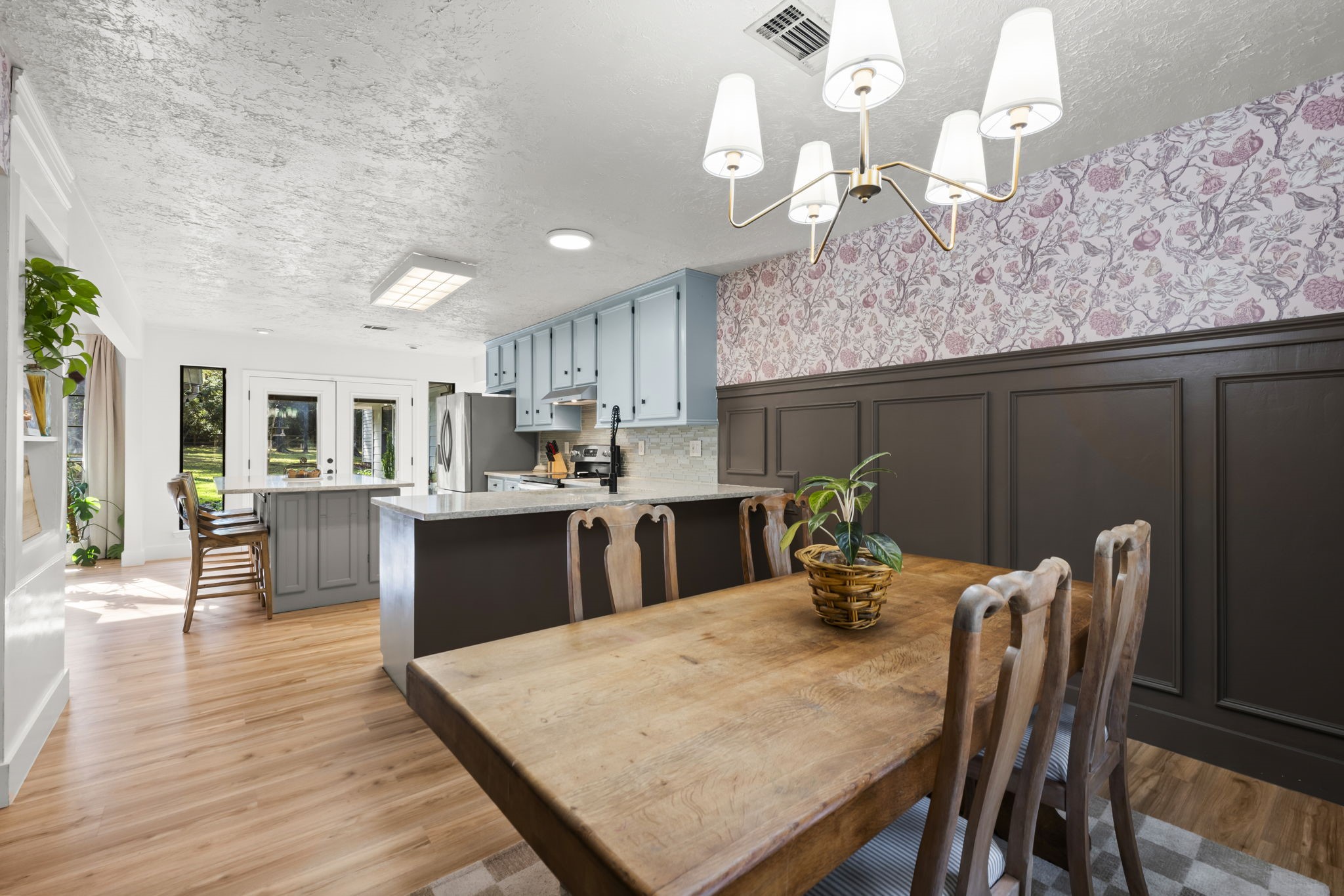 8623 Miller Road Magnolia, TX 77354 - Photo 14 of 44 a kitchen with a table chairs and wooden floor