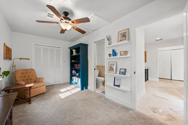 a view of a house with a yard and garage