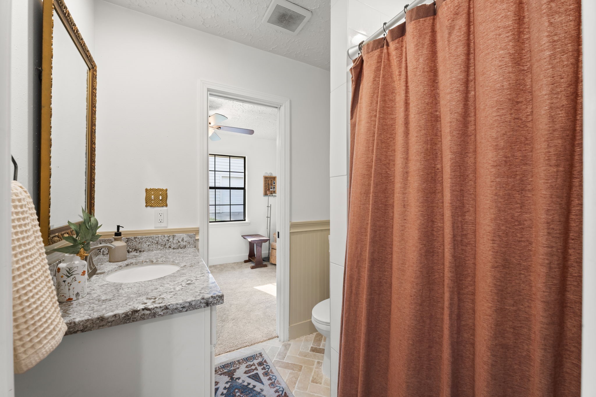 8623 Miller Road Magnolia, TX 77354 - Photo 23 of 44 a bathroom with a granite countertop sink and a mirror