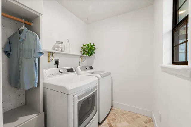 a kitchen with stainless steel appliances a stove sink and cabinets