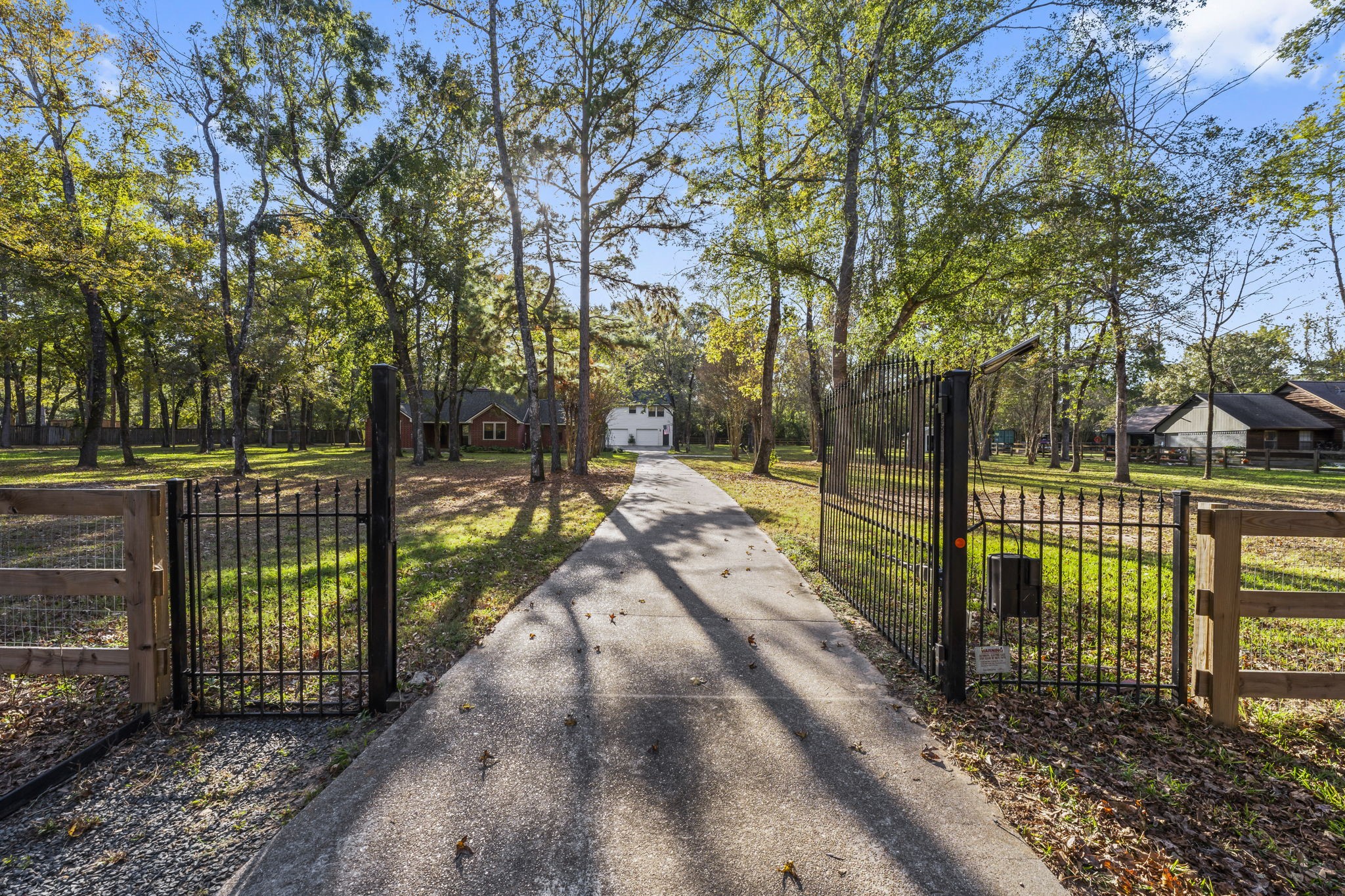 8623 Miller Road Magnolia, TX 77354 - Photo 3 of 44 A welcoming gated entrance leads to this secluded 2.62-acre country home