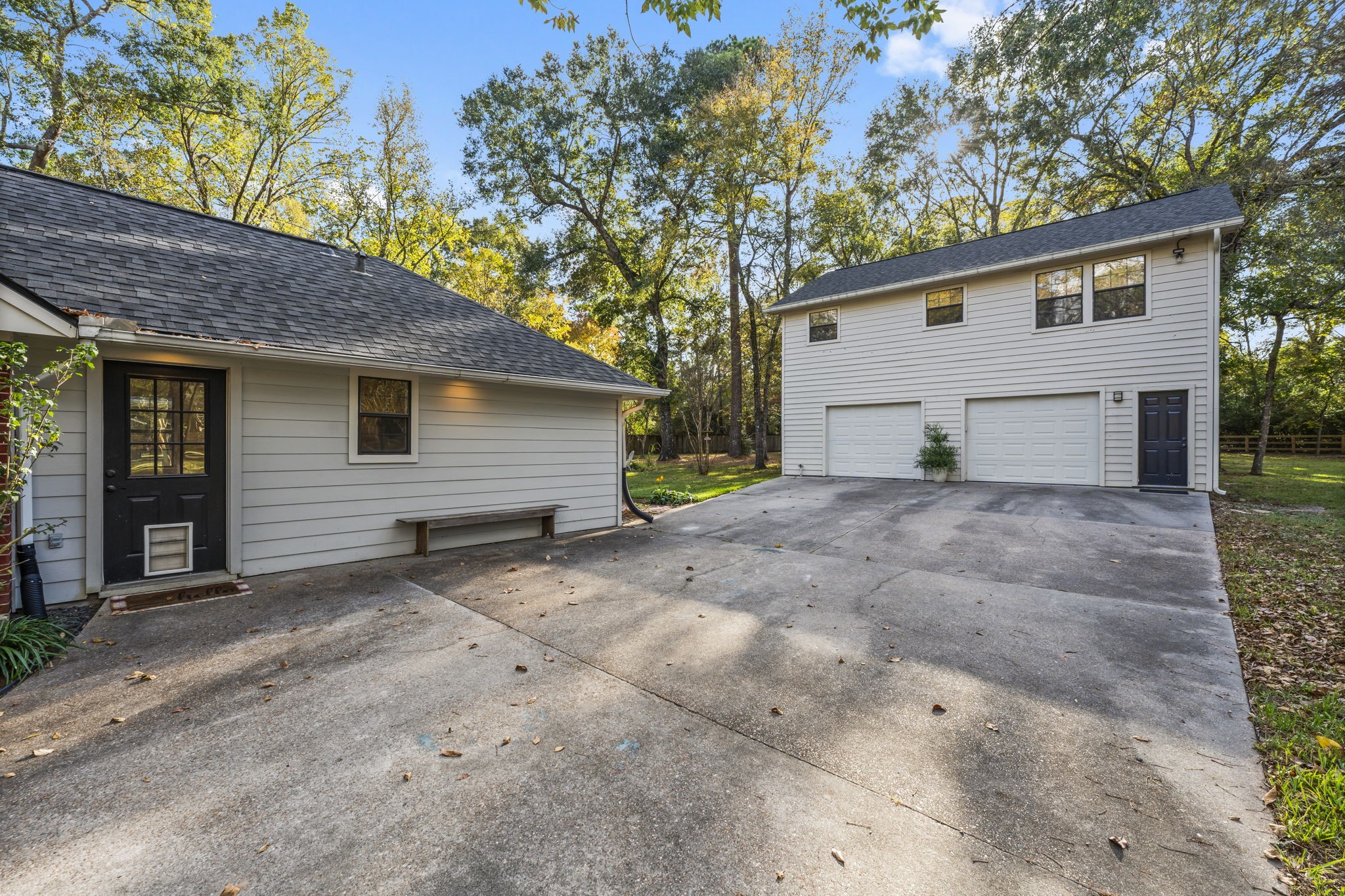 8623 Miller Road Magnolia, TX 77354 - Photo 34 of 44 a view of a house with a yard and garage