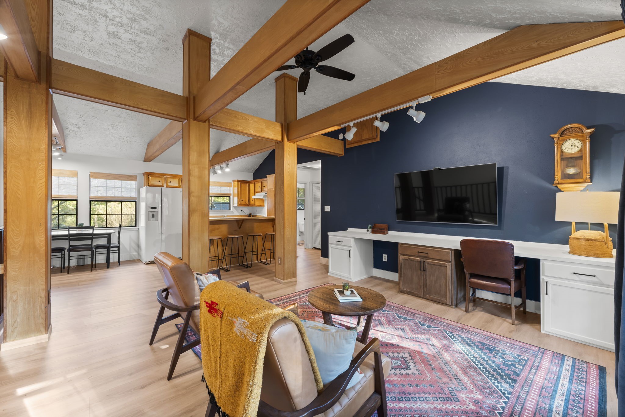 8623 Miller Road Magnolia, TX 77354 - Photo 36 of 44 a living room with furniture a flat screen tv and kitchen view