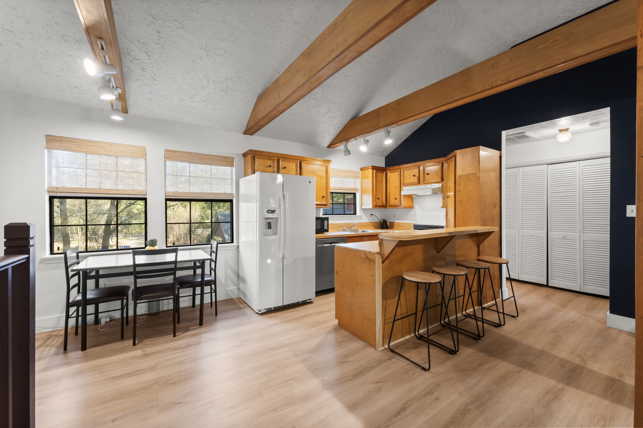 8623 Miller Road Magnolia, TX 77354 - Photo 38 of 44 a dining room with furniture and a floor to ceiling window
