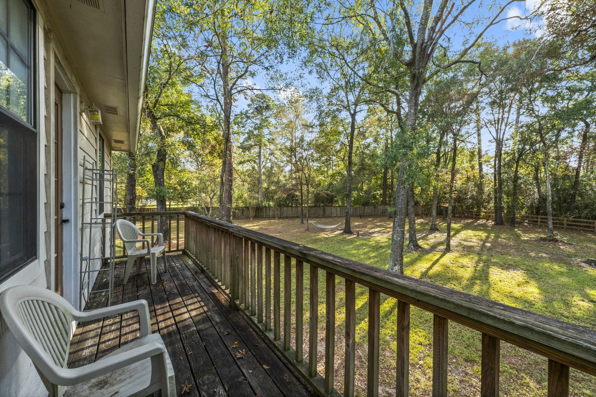 8623 Miller Road Magnolia, TX 77354 - Photo 43 of 44 a view of balcony with wooden floor and fence