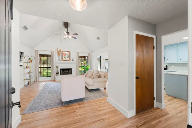 a living room with furniture and a fireplace