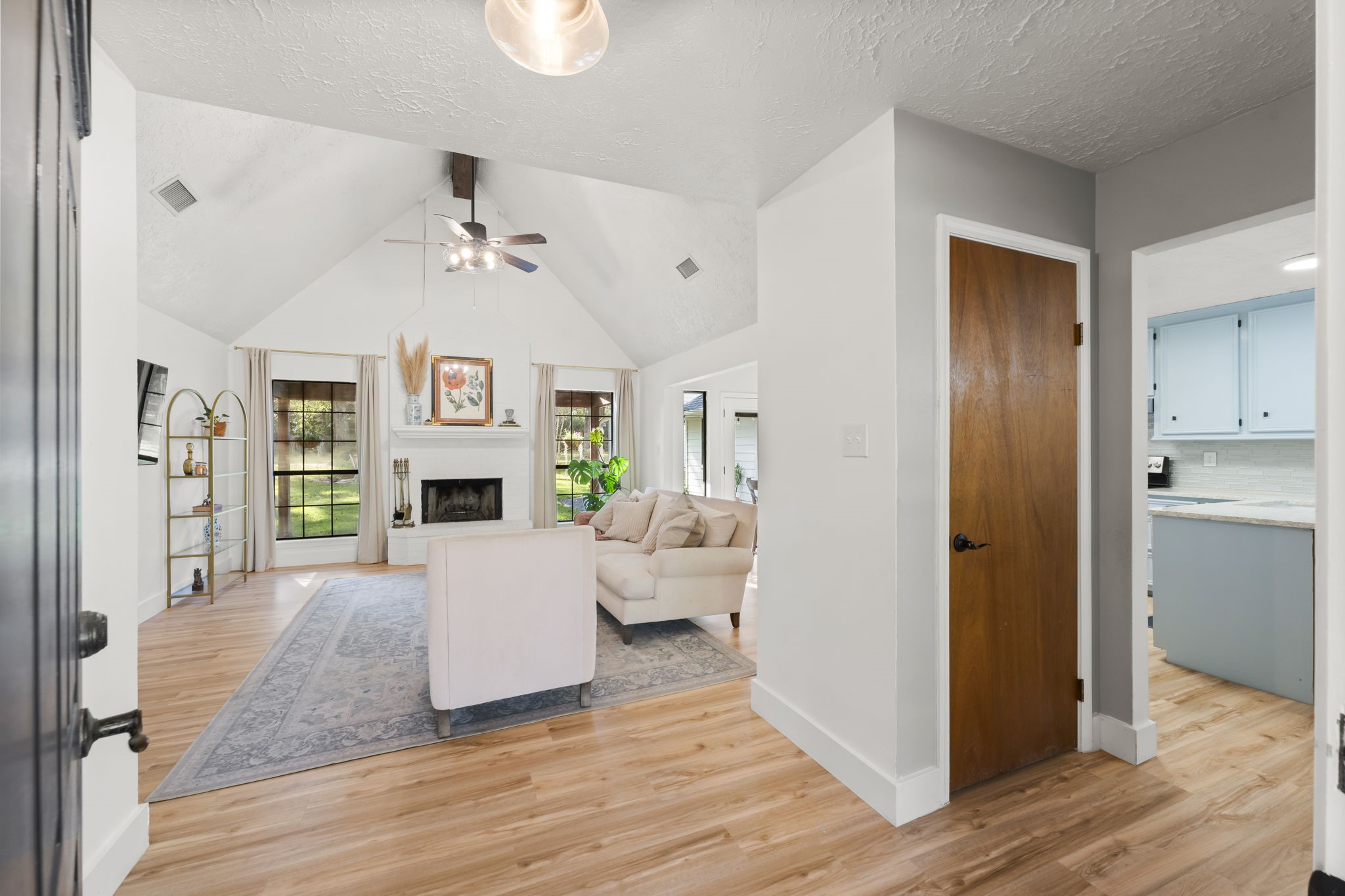 8623 Miller Road Magnolia, TX 77354 - Photo 5 of 44 a living room with fireplace furniture and a wooden floor