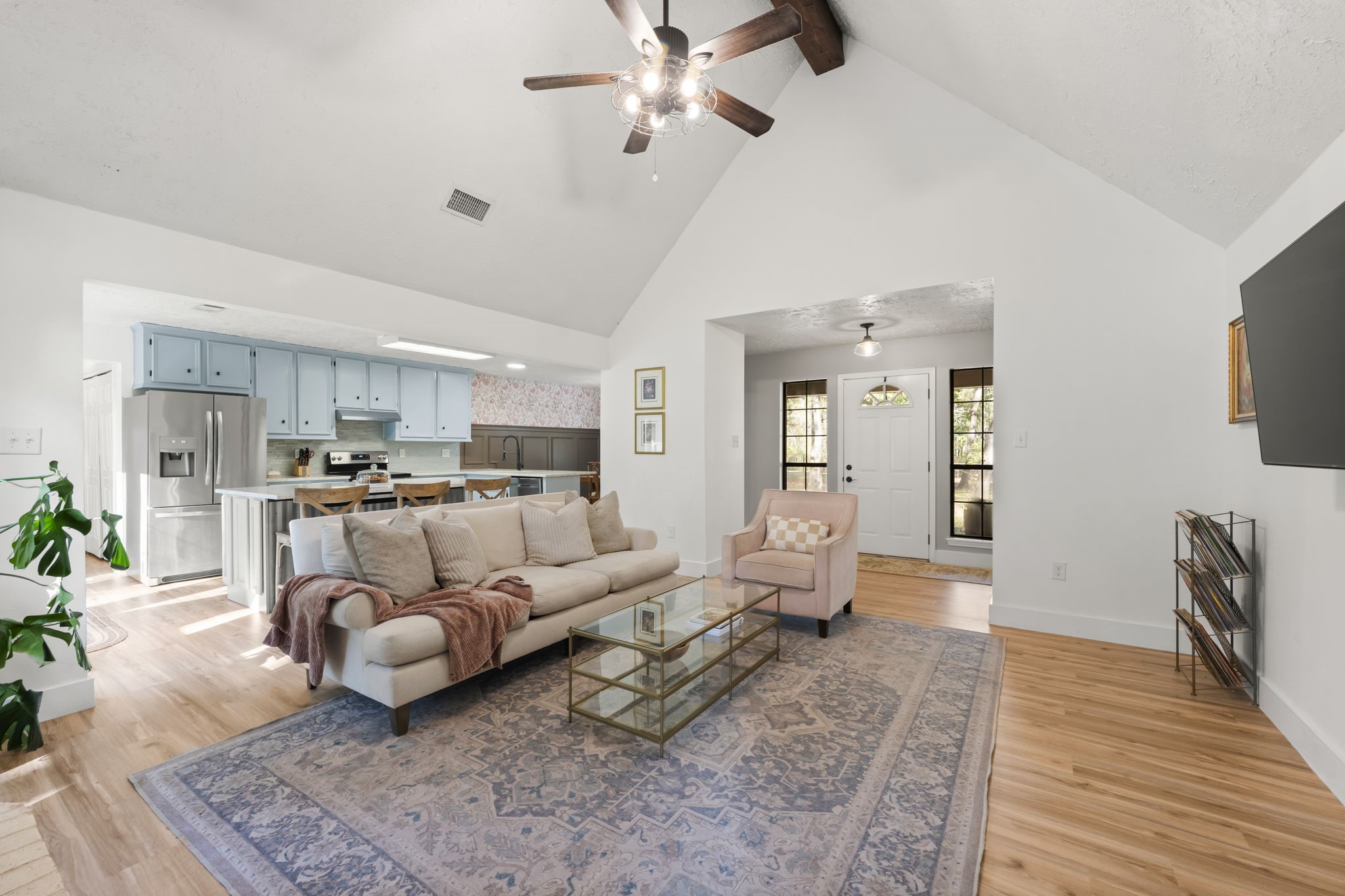 8623 Miller Road Magnolia, TX 77354 - Photo 7 of 44 a living room with furniture kitchen view and a wooden floor