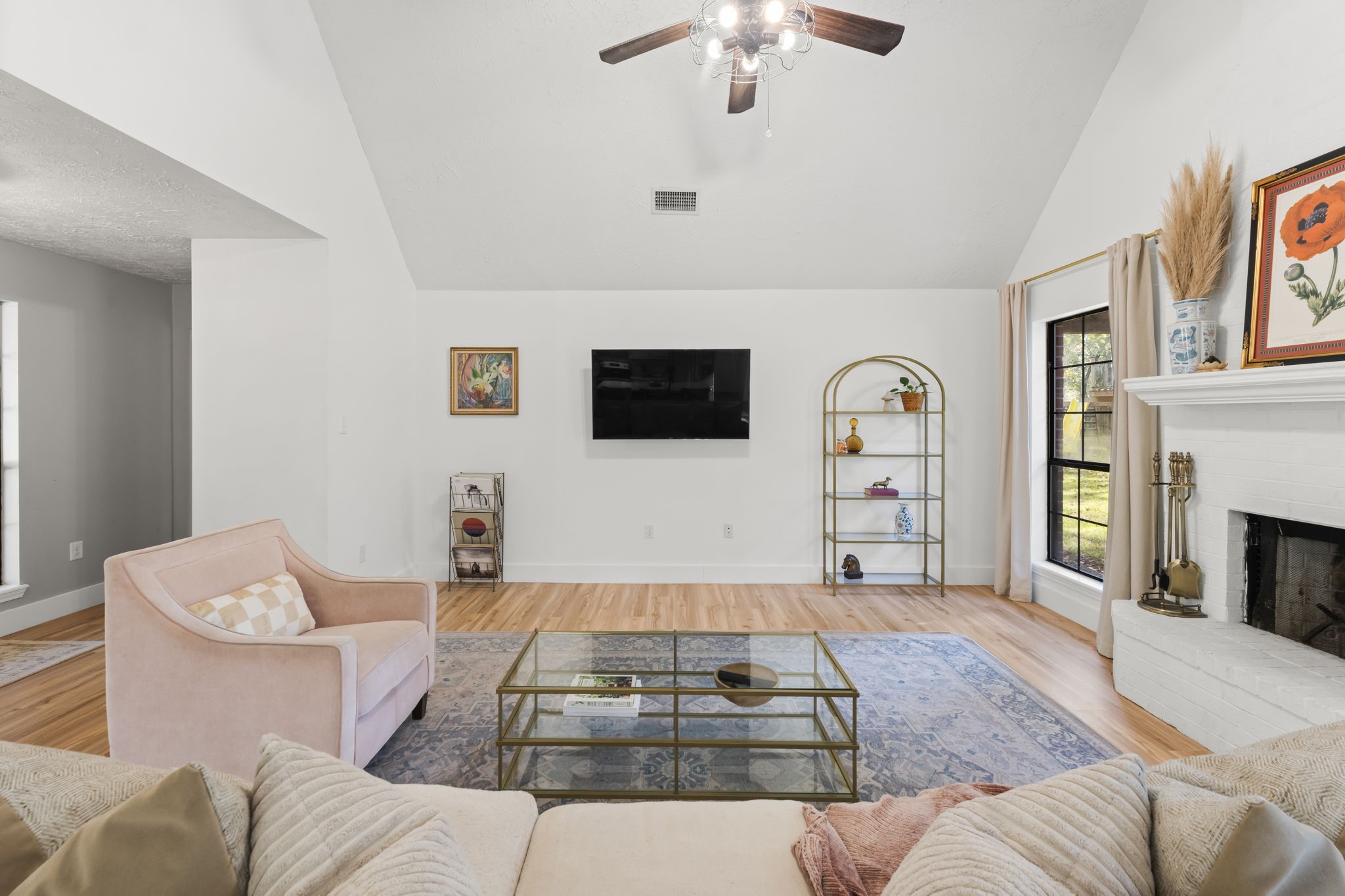8623 Miller Road Magnolia, TX 77354 - Photo 8 of 44 a living room with furniture and a fireplace
