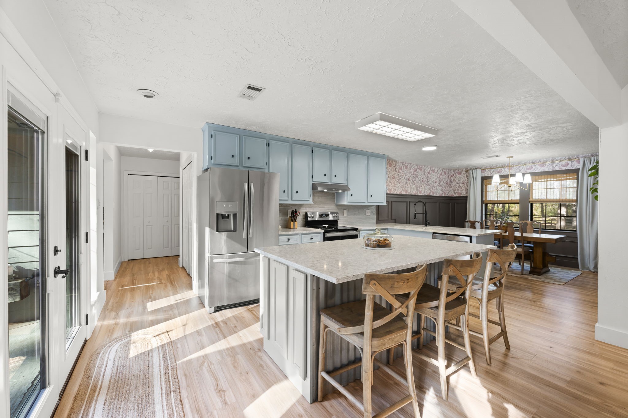 8623 Miller Road Magnolia, TX 77354 - Photo 10 of 44 a kitchen with stainless steel appliances a refrigerator and a stove top oven