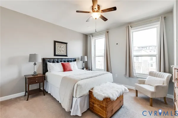 a bedroom with a bed and a couch