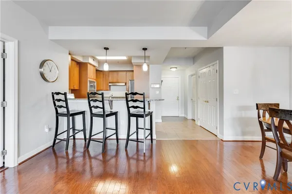a view of a dining room with furniture and wooden floor