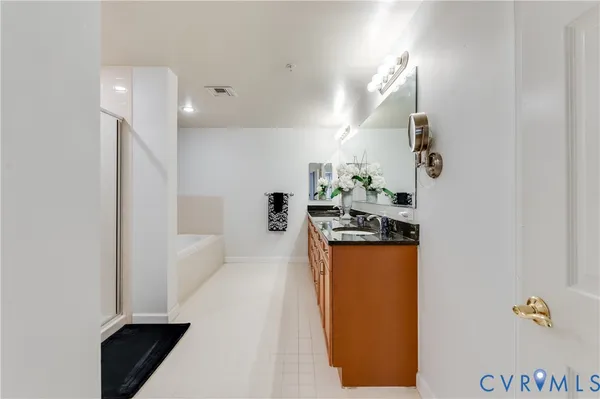 a kitchen with sink and refrigerator