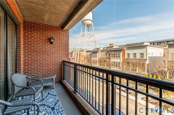 a view of a balcony with chairs