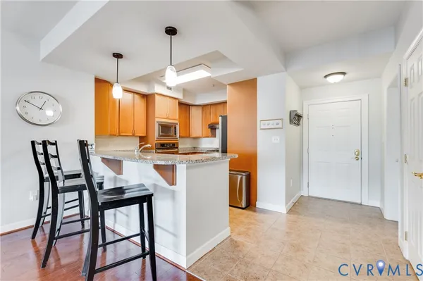 a kitchen with a table and chairs in it