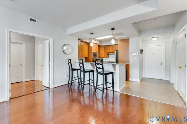 a view of a dining area with furniture and wooden floor