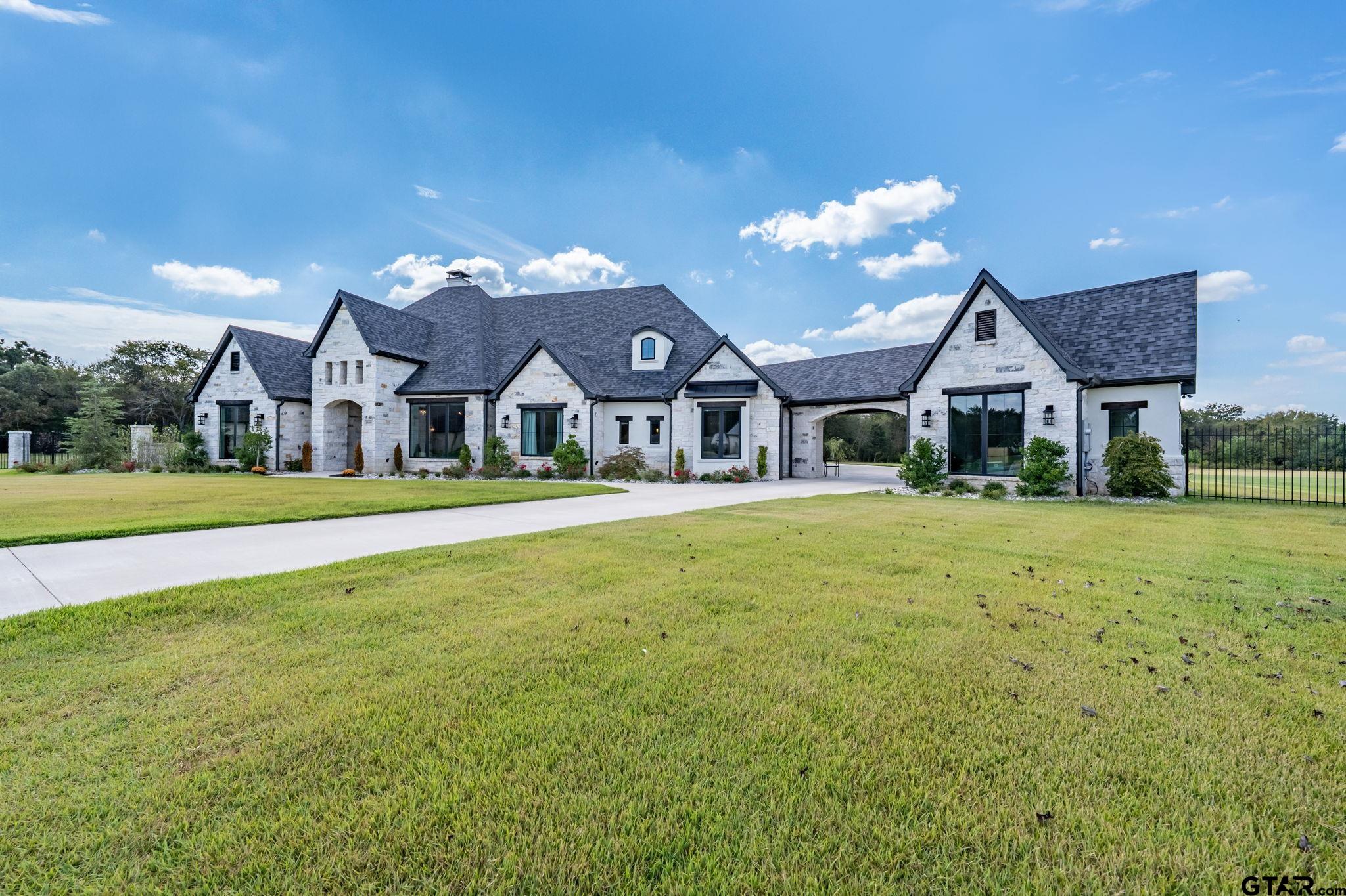 15601 Stampede Run Tyler, TX 75703 - Photo 2 of 48 a front view of house with yard and green space